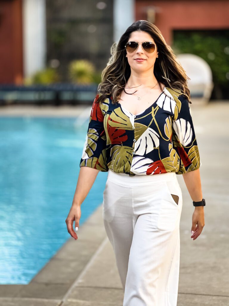 brand photo of a woman walking in a powerful and confident pose
