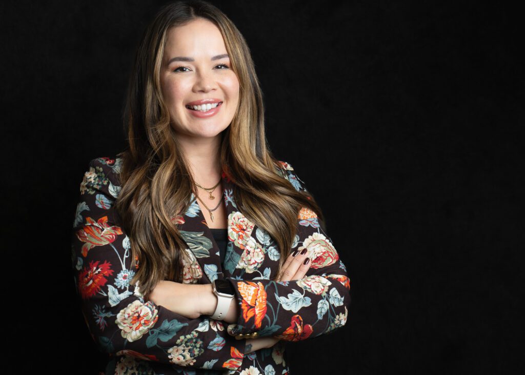 brand headshot of a business owner wearing a pattern blazer