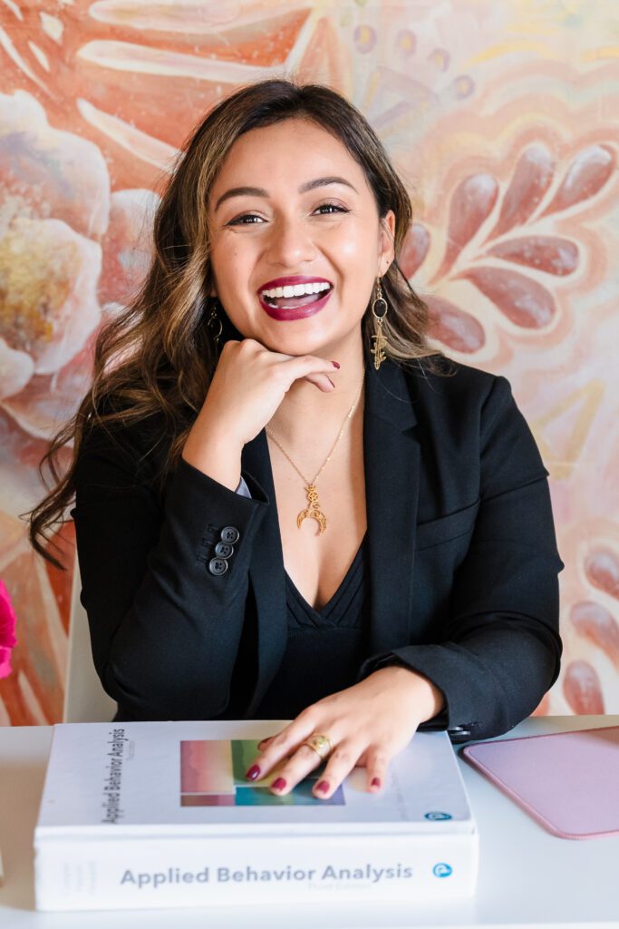 brand photo of a coaching in the home office, hands on her chin