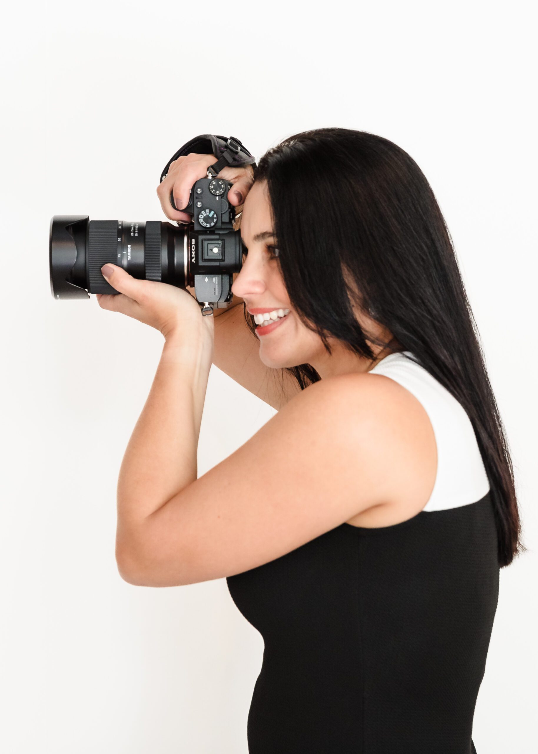 photographer with camera close to her face
