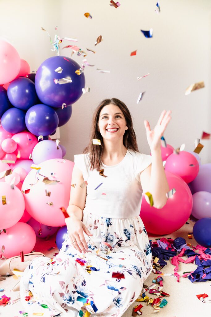 brand photo of a business owner celebrating with confetti