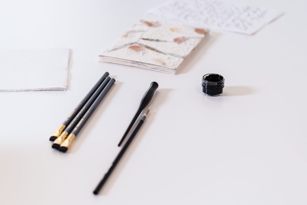 flat lay image of calligraphy gears