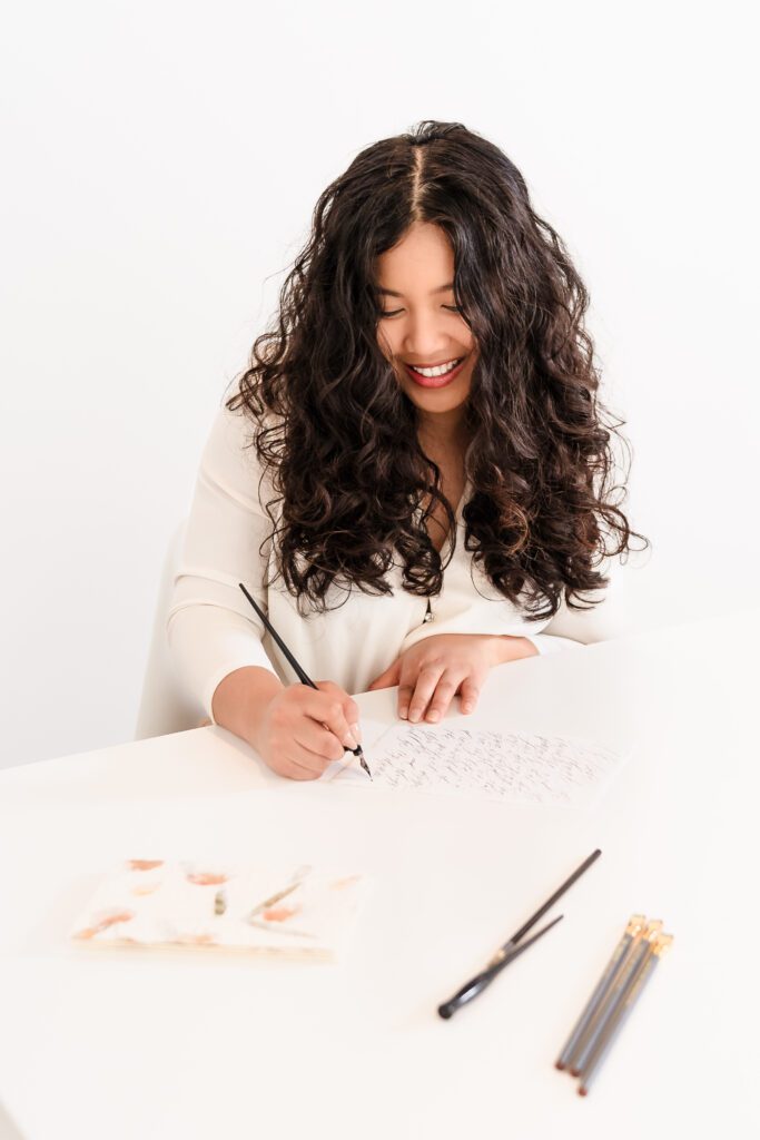 brand photo of a calligrapher writing