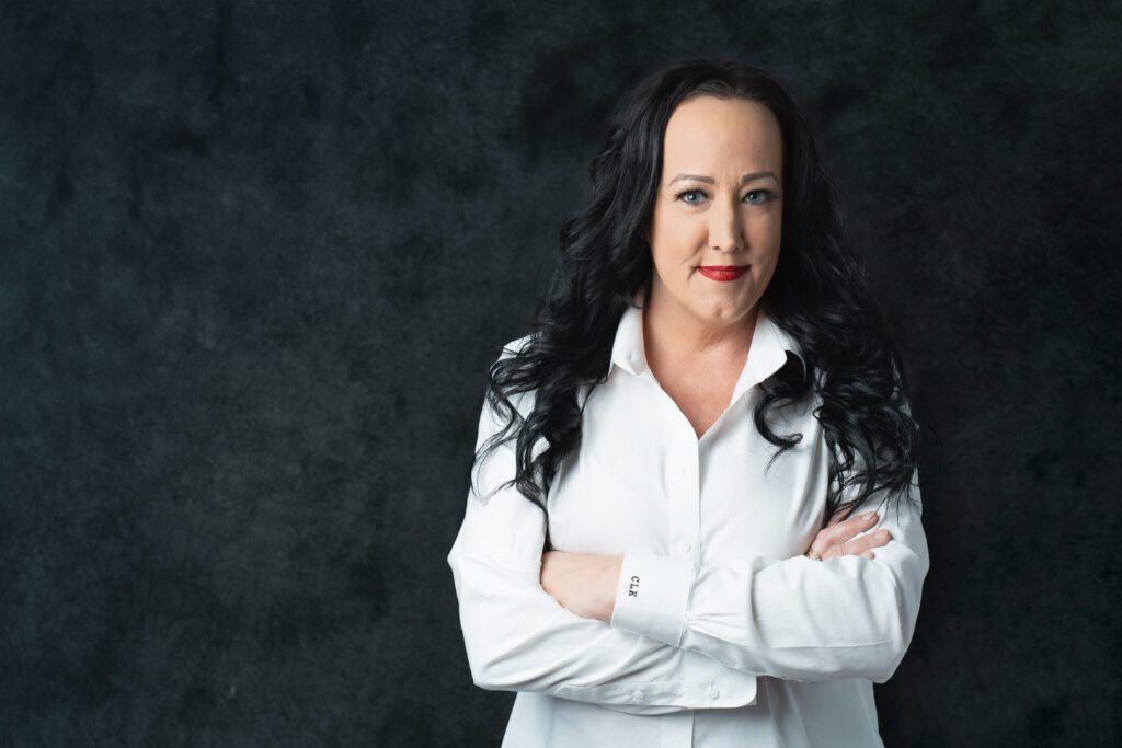 Headshot of a woman in a power pose