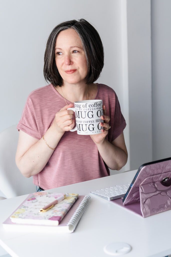 brand photoshoot for a photographer sipping a coffee in her office desk